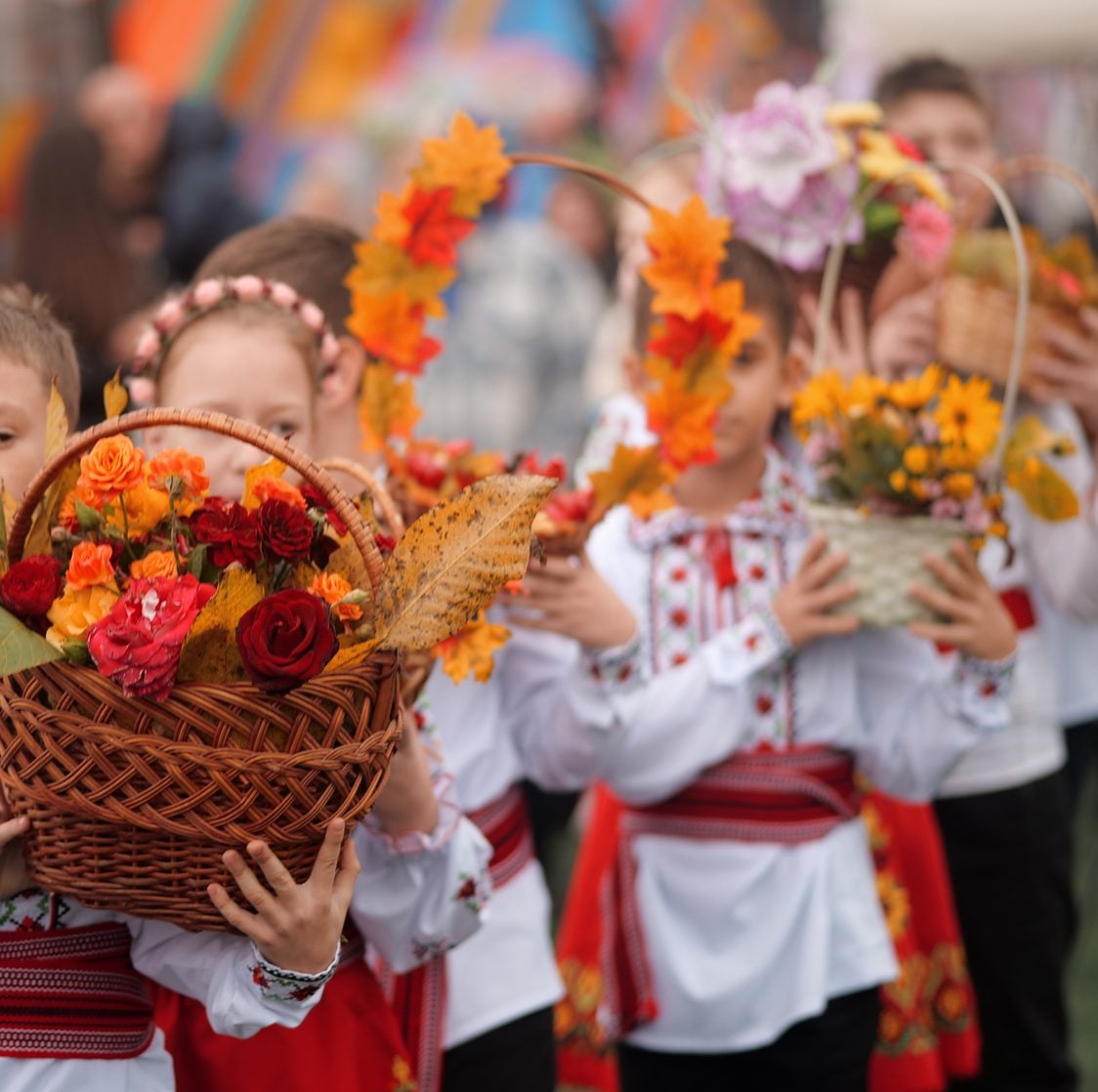 Children in traditional costume with flower baskets at the Town Feast Day