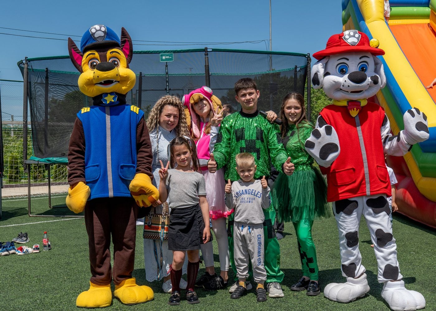 Children and entertainers dressed as cartoon characters on Children’s Day