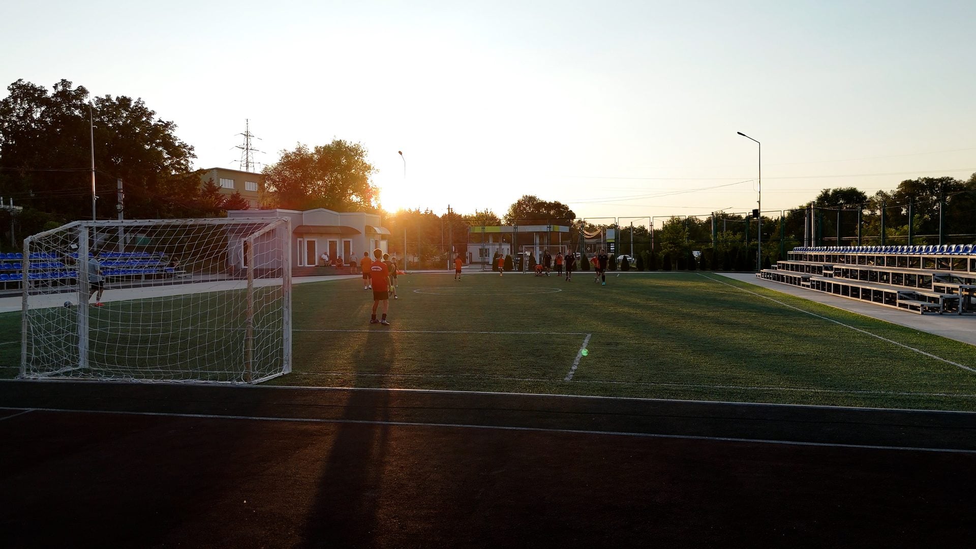 The stadium football pitch at sunset